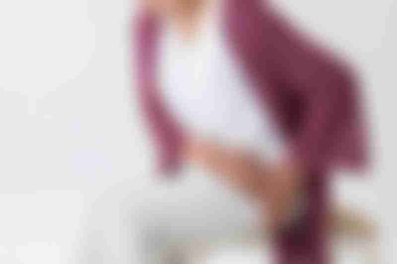 Woman Holding Thigh in Pain