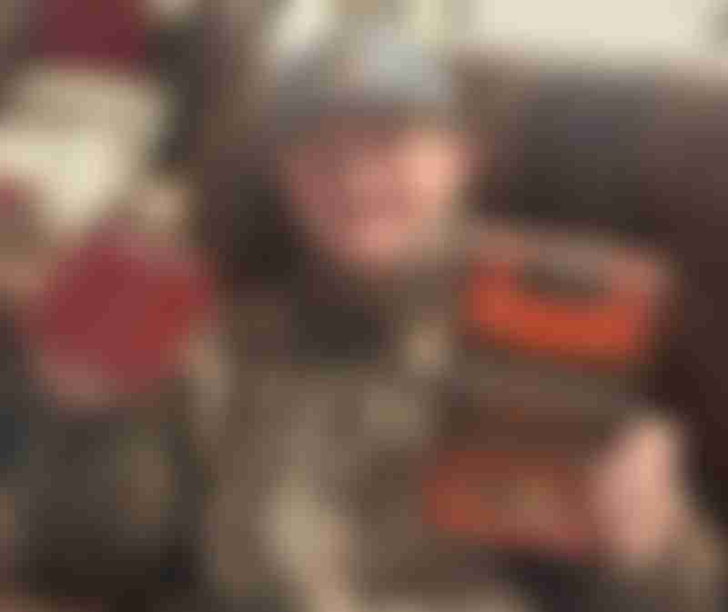 Will Roberts holding a book and deck of cards