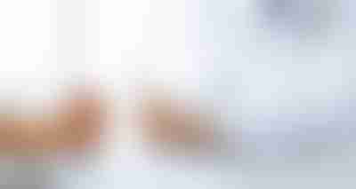 Doctor Talking To Female Patient