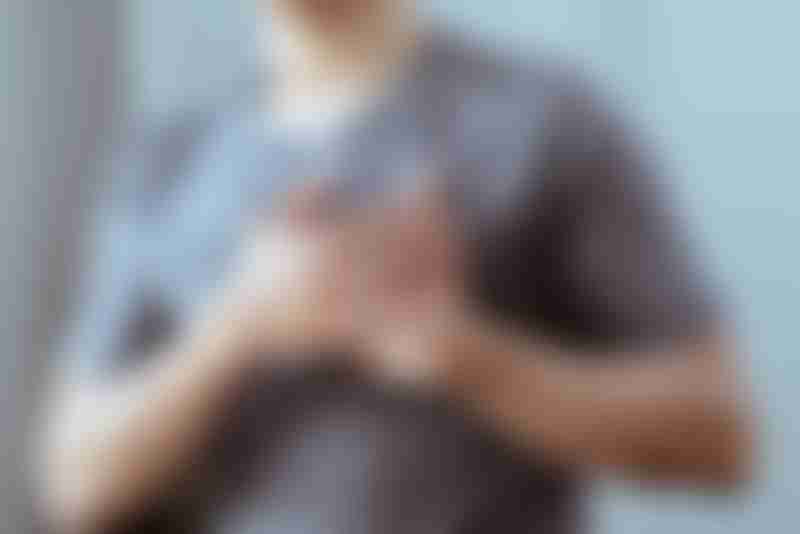 Man Holding Chest