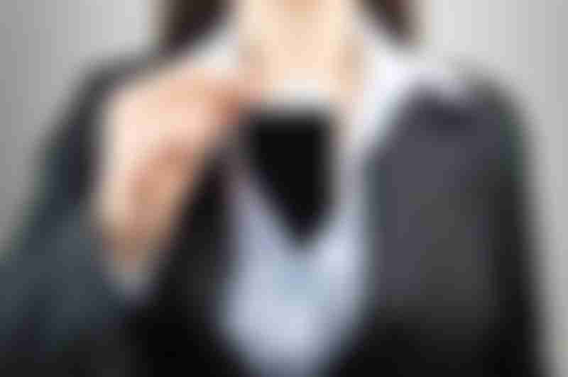 Woman with Cellphone in Bra