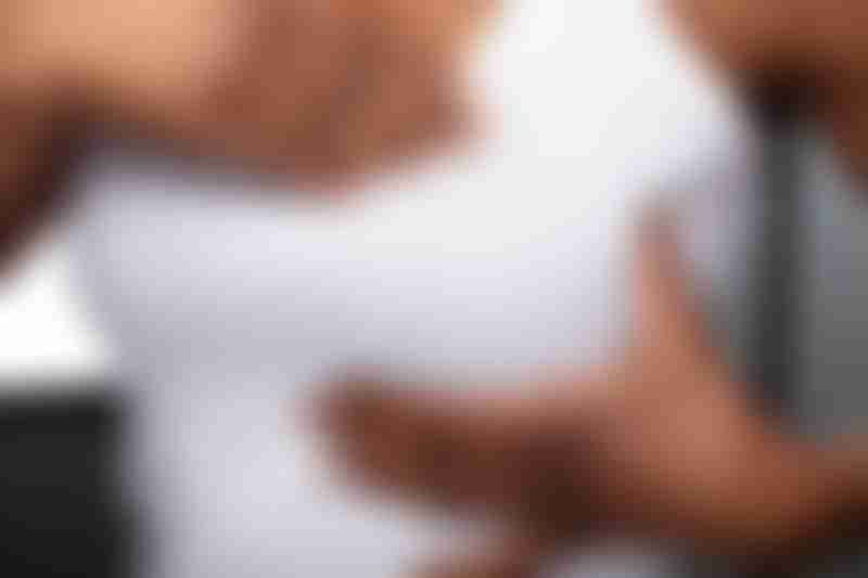 Black Woman Holding Breast