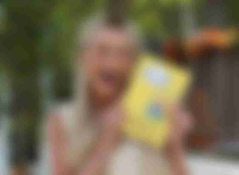 MacKenzie Paul holding her book