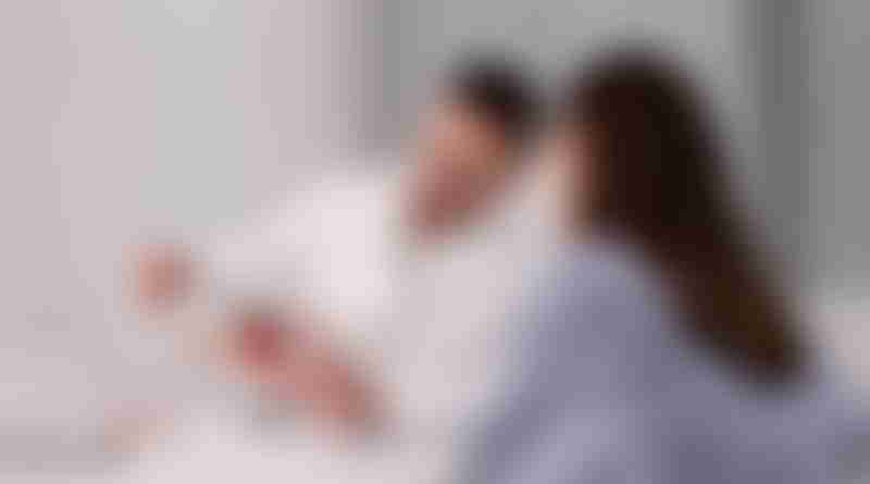 Young male gynecologist explains ovarian anatomy to woman