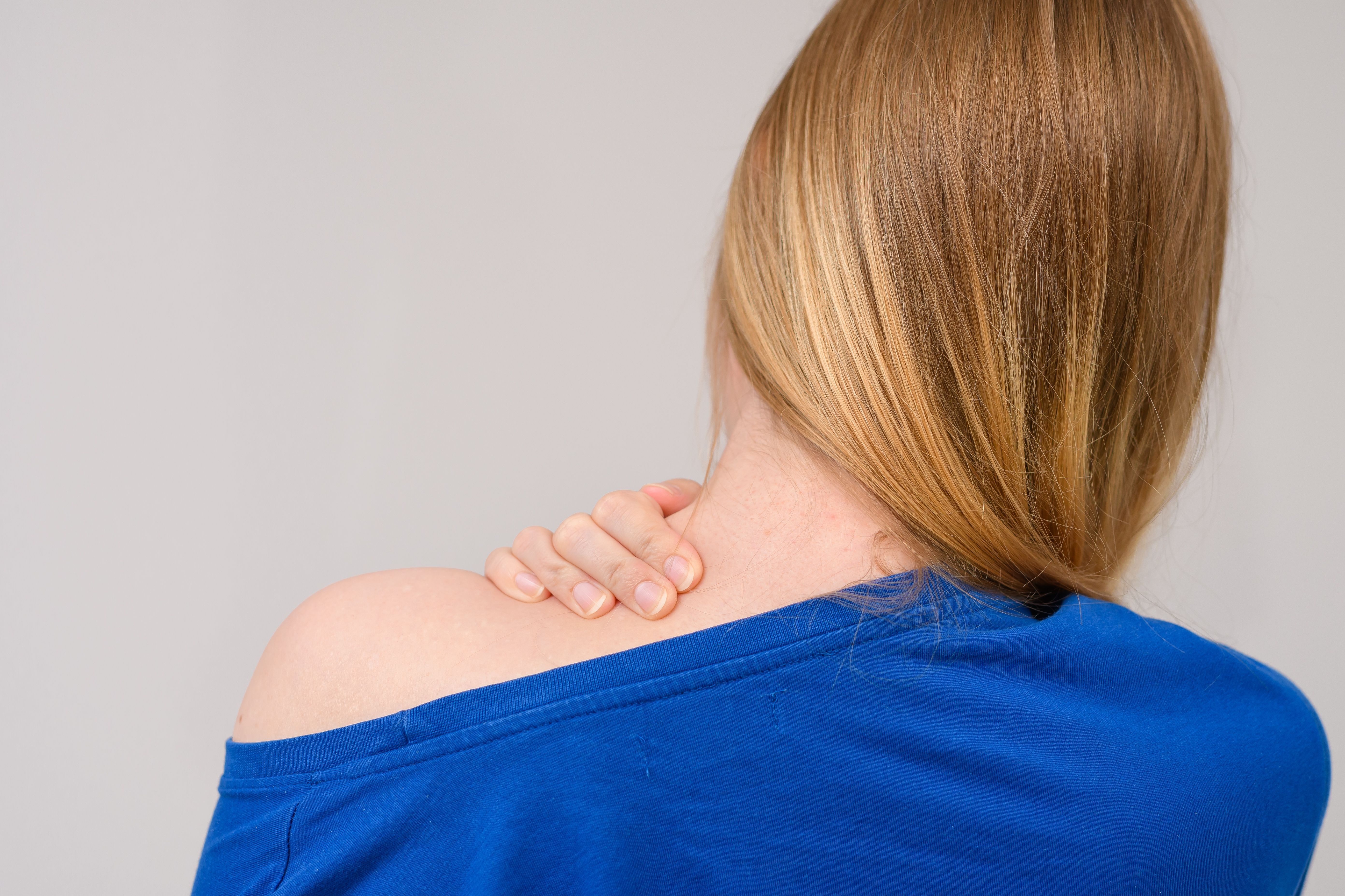 Woman touching skin