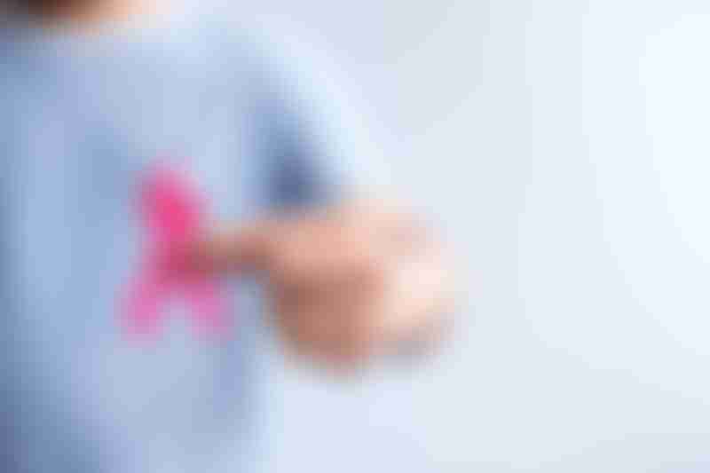 Man Holding Pink Ribbon