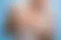 Woman Holding Breast