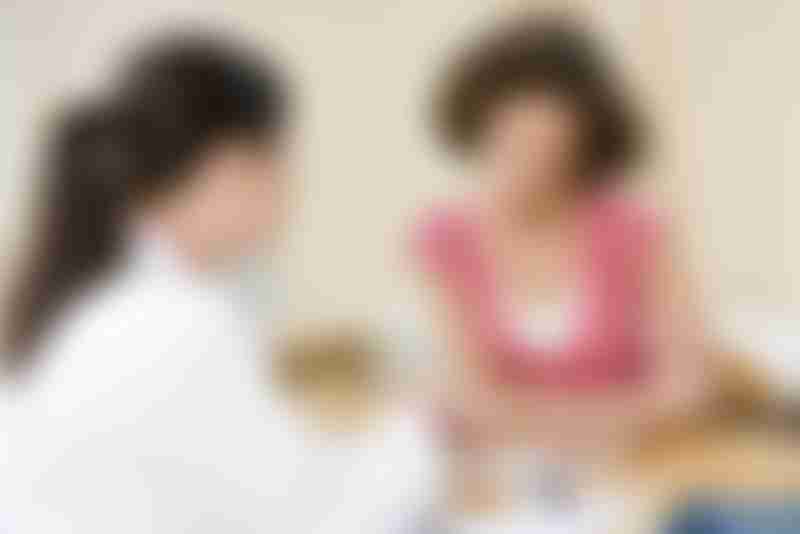 Woman Consulting Doctor