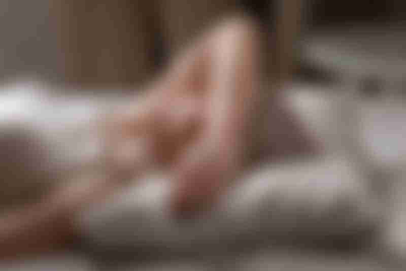 Sick Woman Resting in Bed
