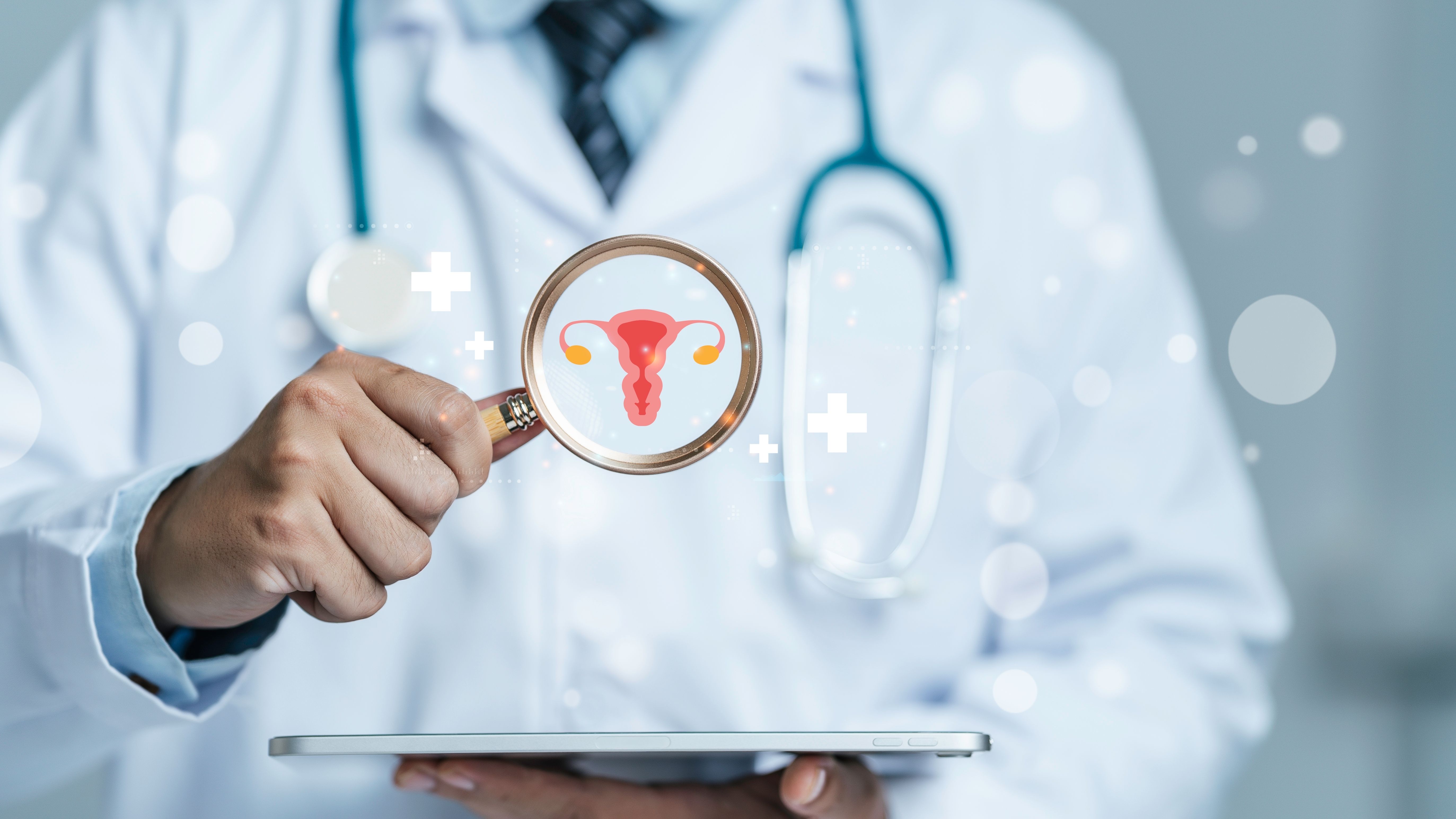 Doctor is holding a magnifying glass with uterus symbol