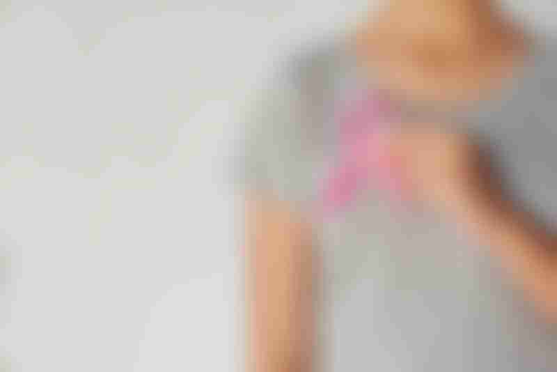 Woman Pink Ribbon on Chest