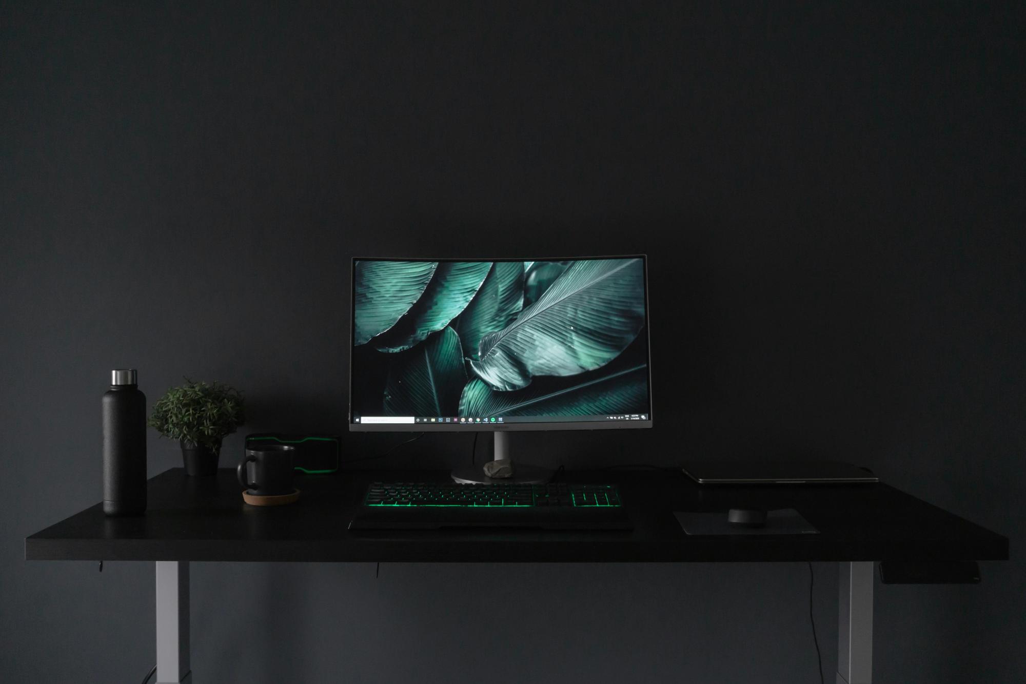 An uncluttered desk with a single notebook.