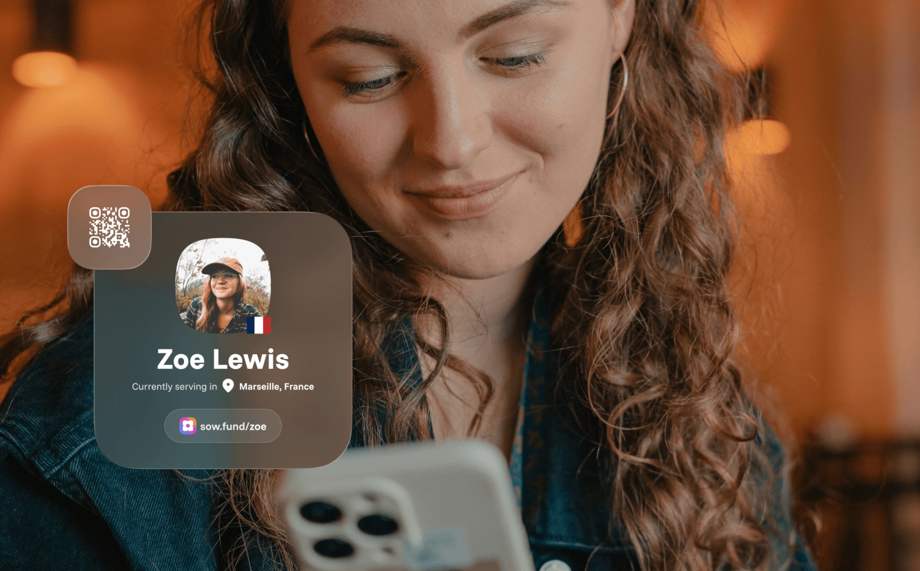 A woman smiling at her phone, with a sample Sowfund missionary profile card for "Zoe Lewis — currently serving in Marseille, France" showing her profile link at sow.fund/zoe and a QR code.