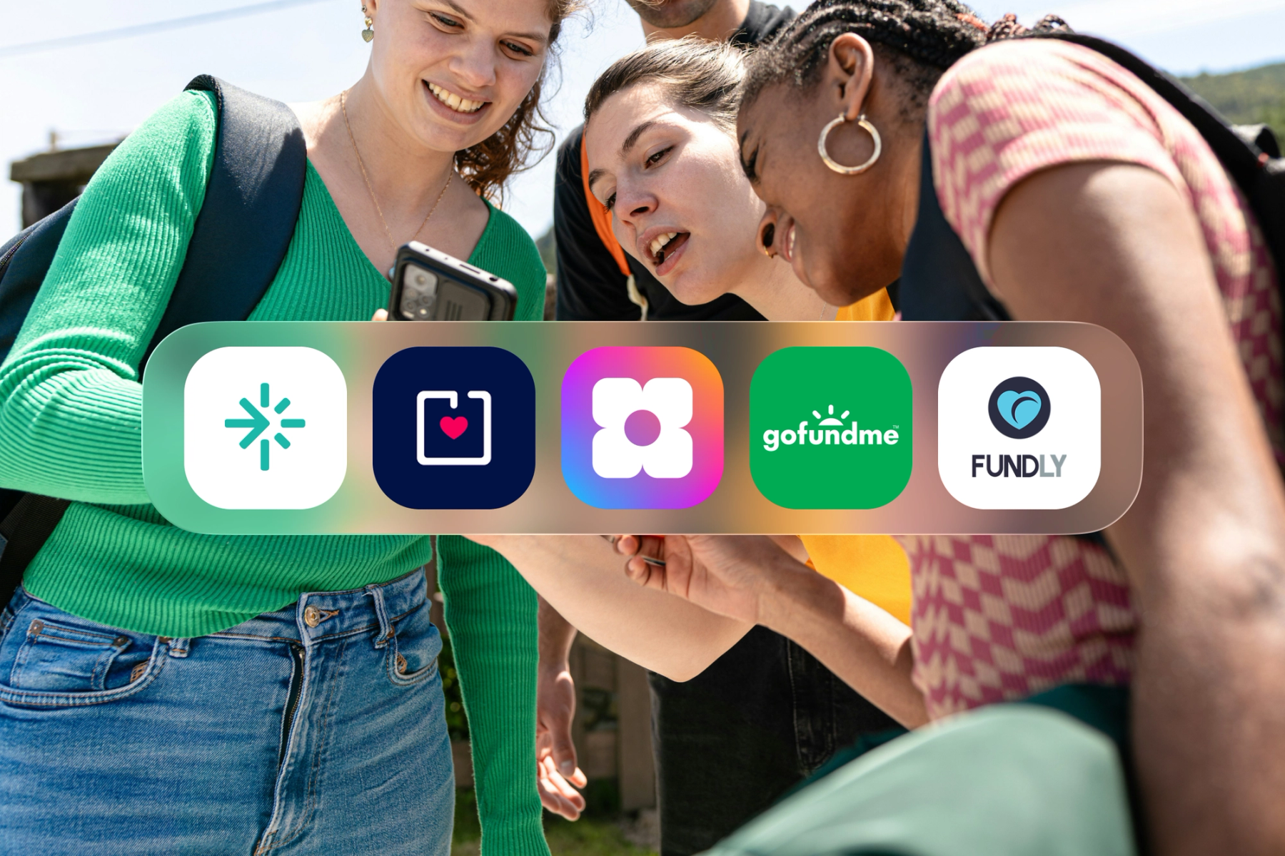 A group of young people gathered around a smartphone outdoors, with app icons for five fundraising platforms — including GoFundMe, Sowfund, and Fundly — overlaid across the image.