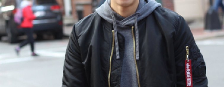 dude in the street with a jacket