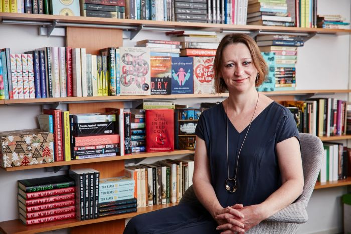 Author in a home library