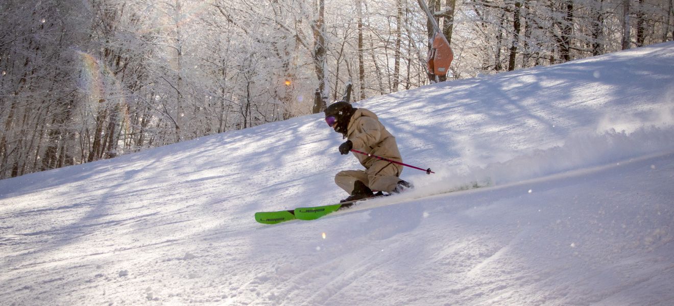 2022 Elan Ripstick 106 Black Edition Ski Review: Full Width Action Image 2