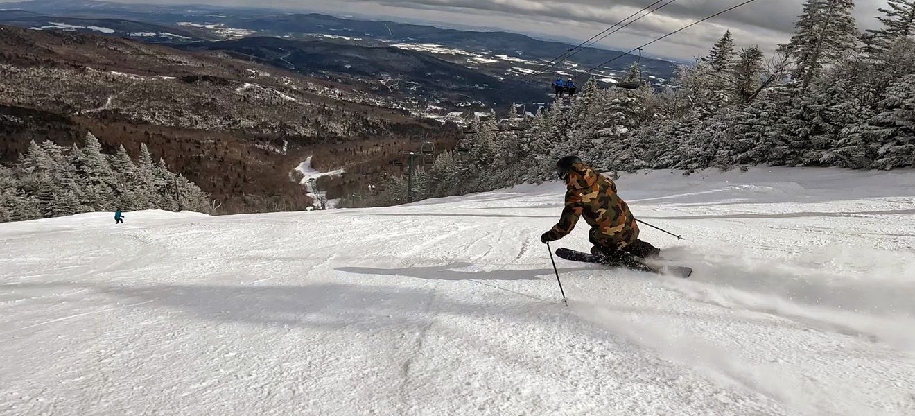 2023 Rossignol Rallybird 104 Ti Skis: Full Width Action Image 2