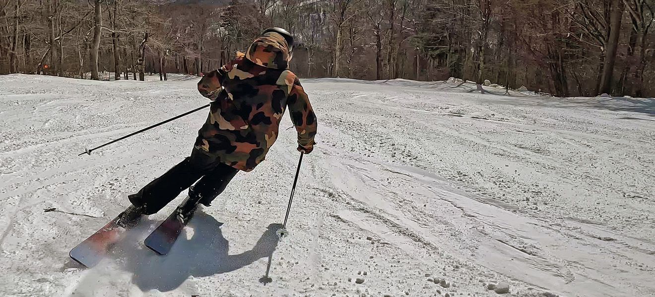 2023 Rossignol Rallybird 104 Ti Skis: Full Width Action Image 1