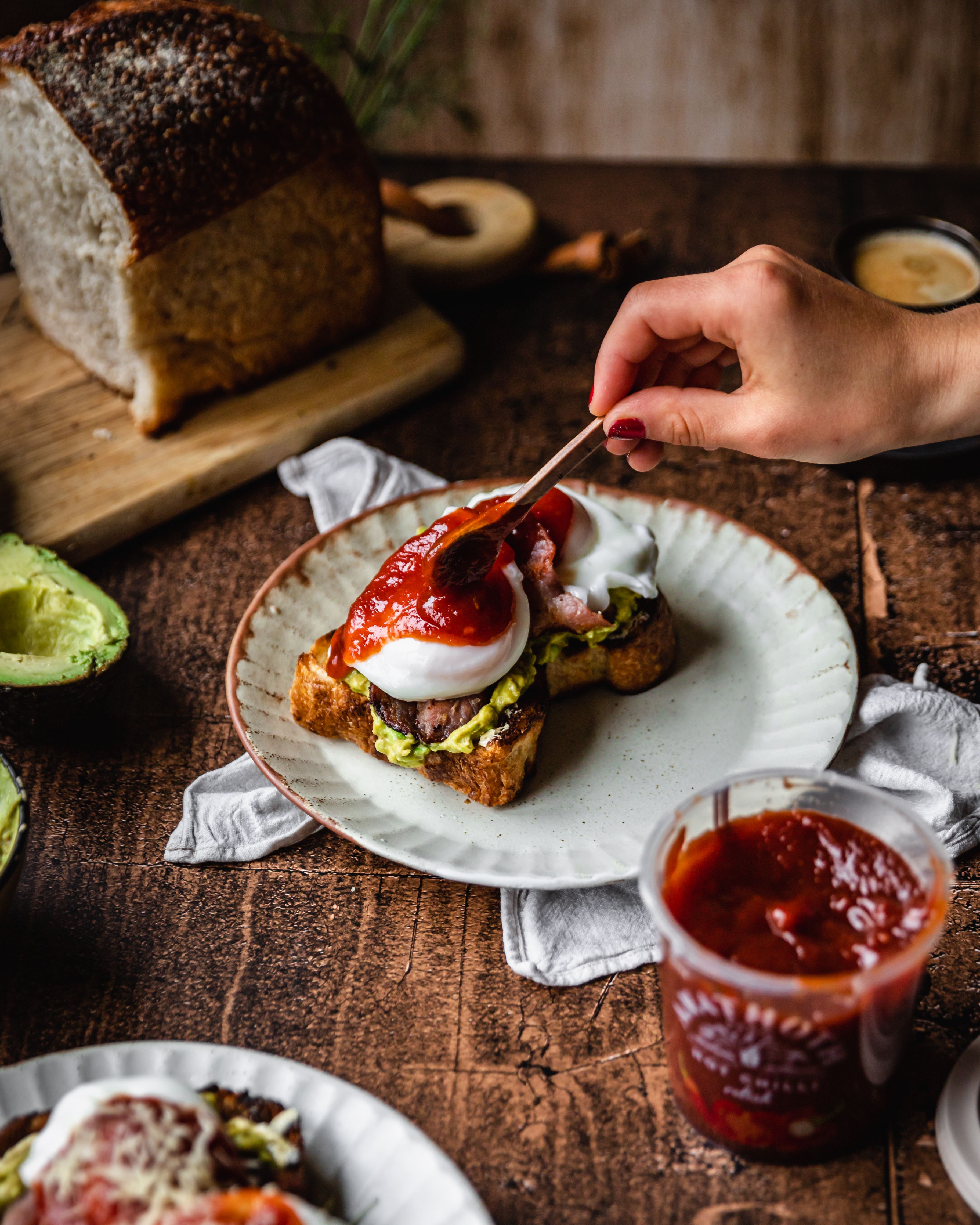 Smashed Avocado Toast with Hot Chilli Relish, Bacon, Poached Eggs