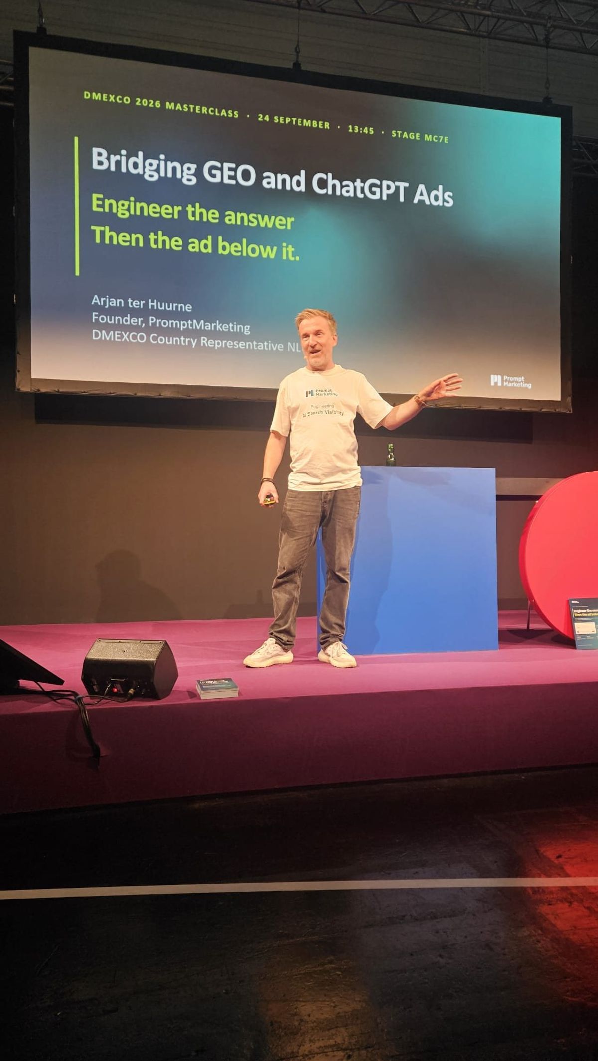 Arjan ter Huurne on stage at DMEXCO 2026 in front of the title slide Bridging GEO and ChatGPT Ads.