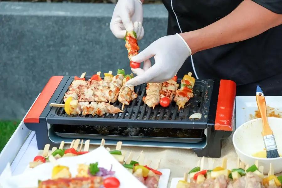 BBQ Gloves for Safe Handling of Skewers on the Grill During Outdoor Cooking