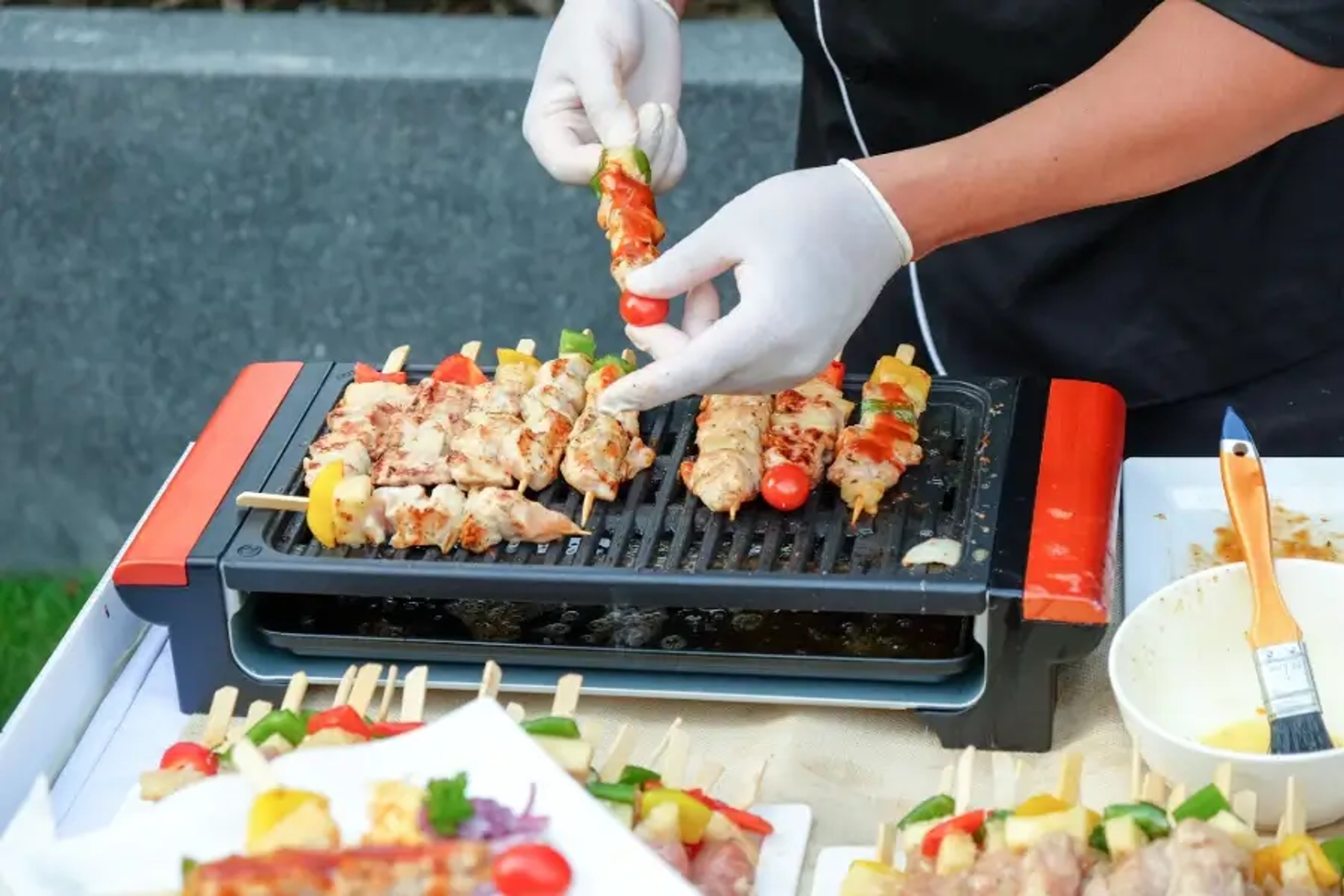 BBQ Gloves for Safe Handling of Skewers on the Grill During Outdoor Cooking
