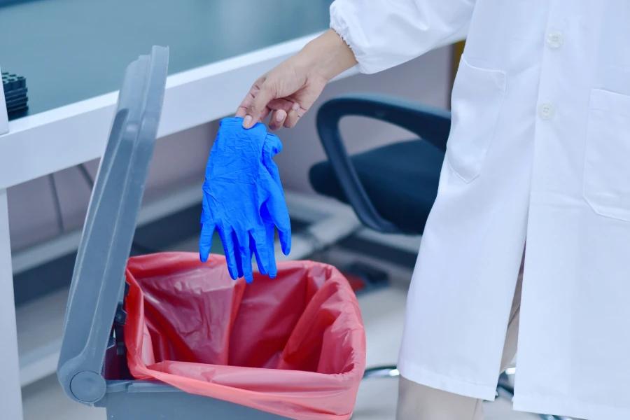 Nitrile gloves for safe laboratory waste disposal in medical settings.