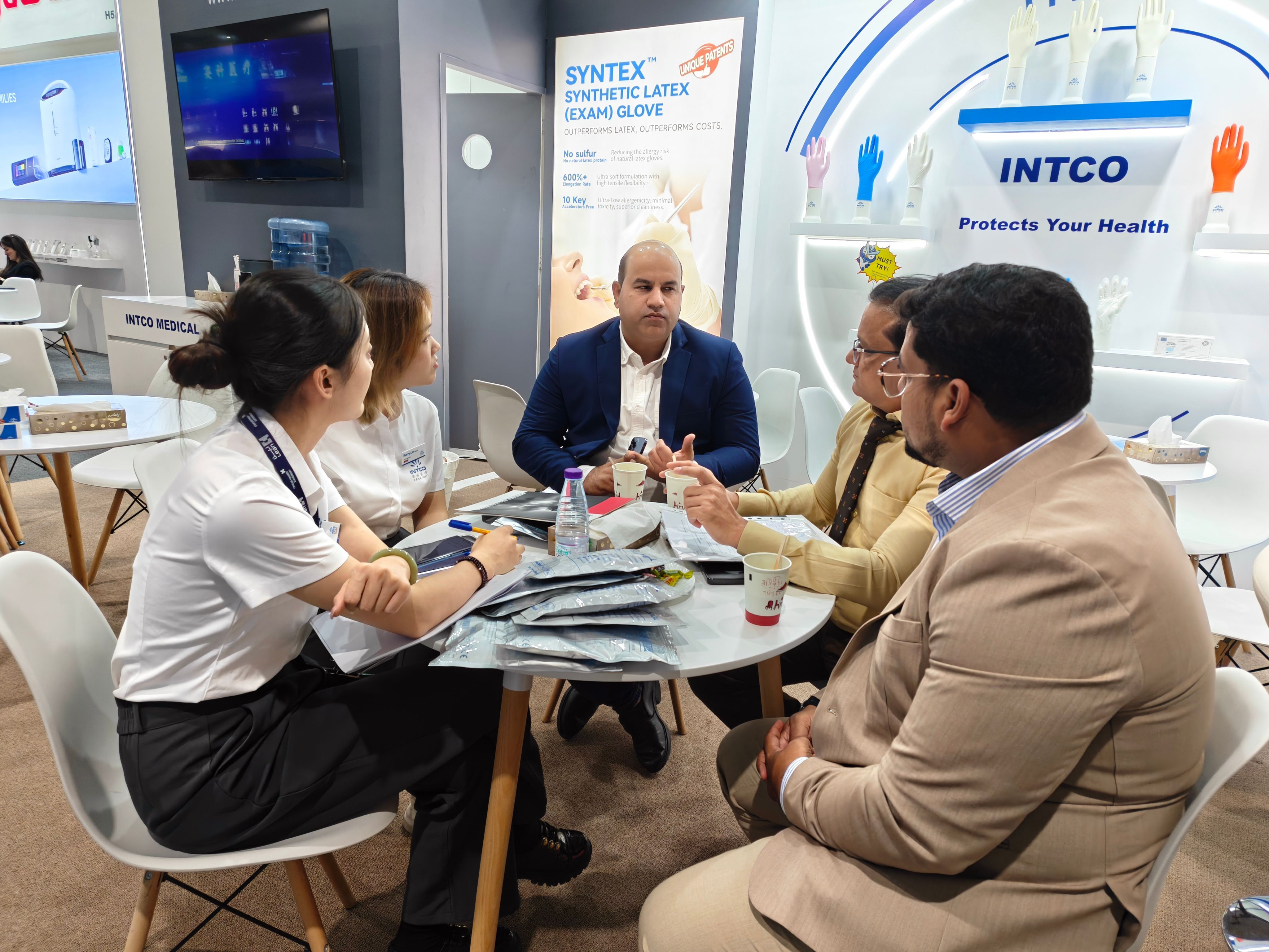 INTCO Medical team meeting with visitors at the Global Health Exhibition 2026 booth