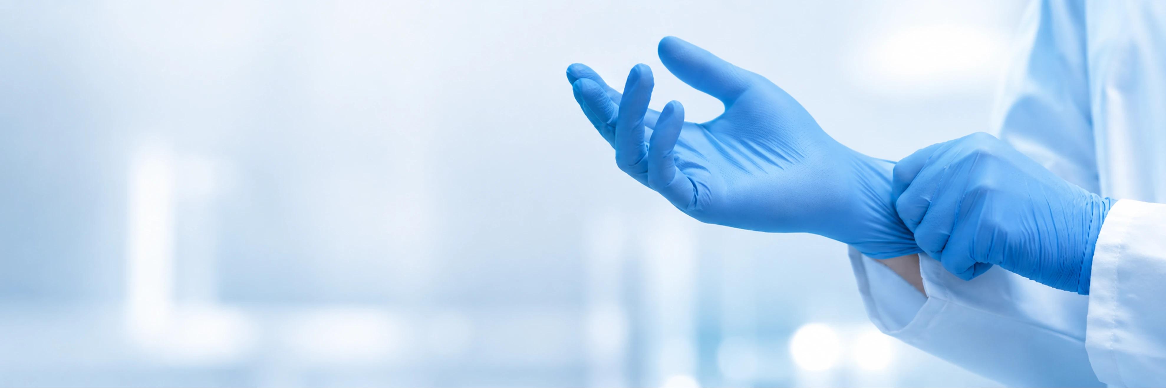 Blue nitrile examination gloves showing surface texture, fit, and cuff details