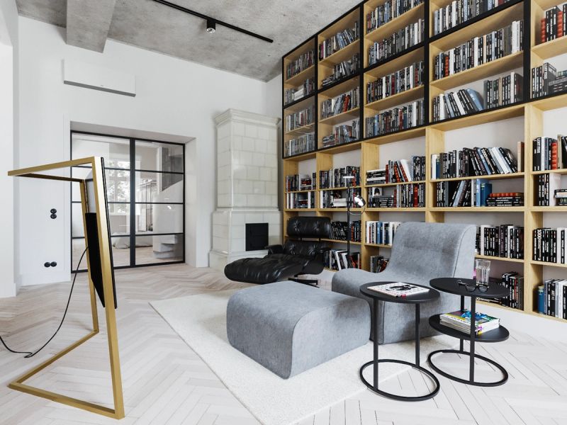 Nowoczesne biuro z drewnianymi regałami na książki, szarymi pufami, czarnym stolikiem i betonowym sufitem w stylu industrialnym