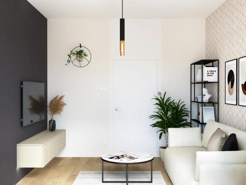 Cały pokój z perspektywy okna. Widać proporcje — 12,8 metra kwadratowego, a nie brakuje ani fotela, ani regału, ani miejsca do przejścia. Pnącze w metalowej obręczy na grafitowej ścianie.