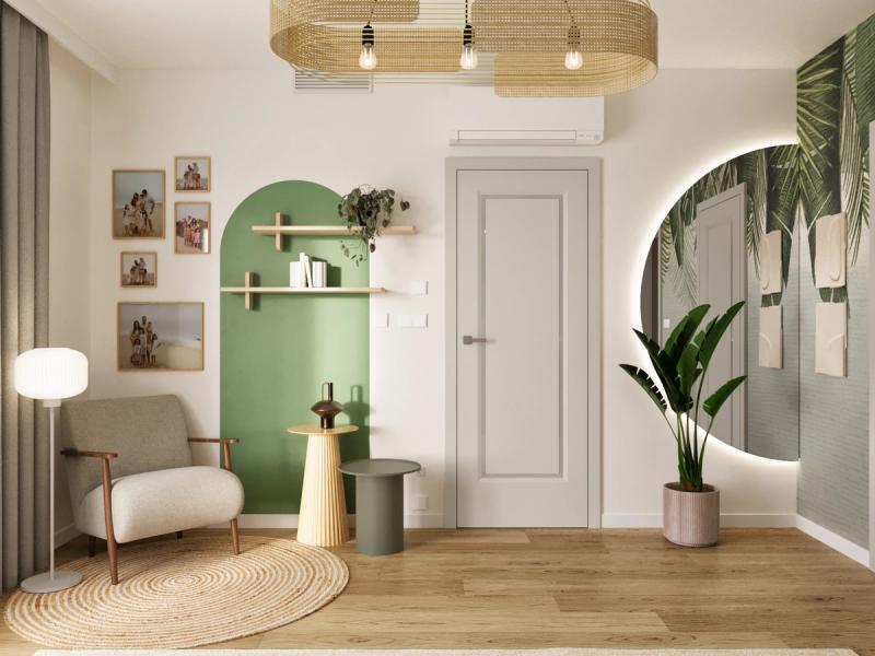 Fotel z drewnianymi podłokietnikami przy oknie. Zielony łuk namalowany na ścianie z drewnianymi półkami — książki, rośliny. Galeria rodzinnych zdjęć w ramkach. Jutowy dywan.