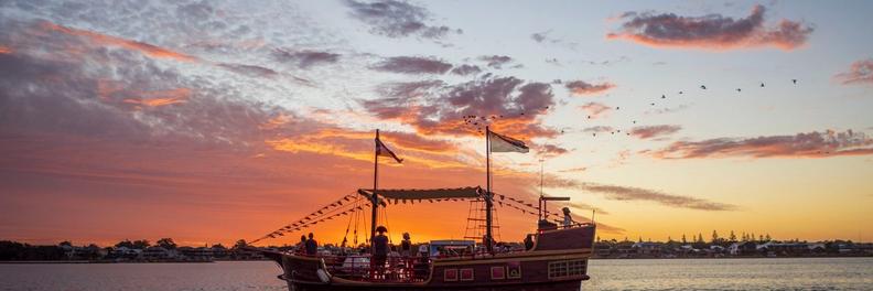 The Pirate ship with a beautiful orange sunset