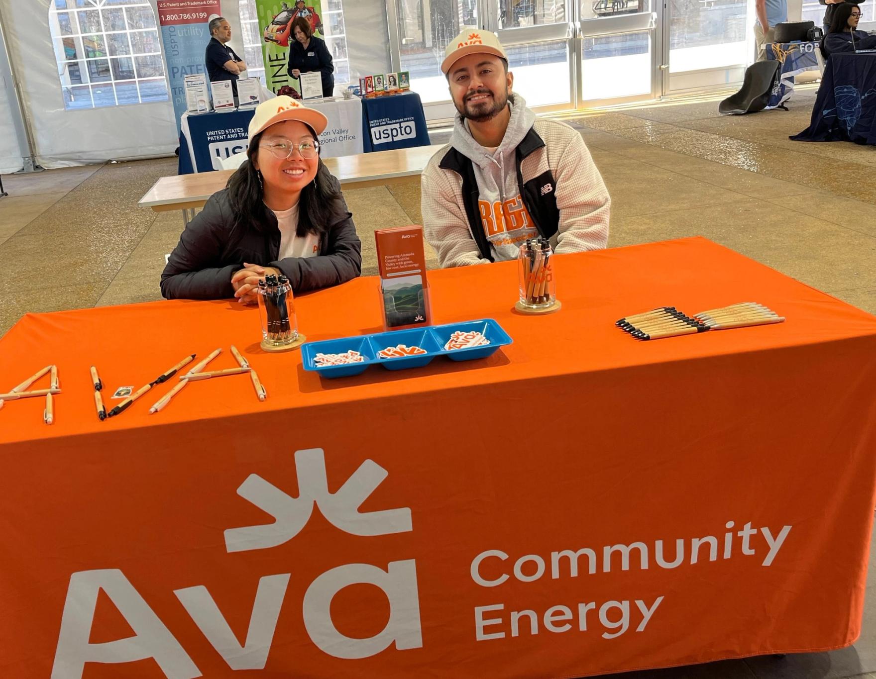 Two Ava employees tabling at an event