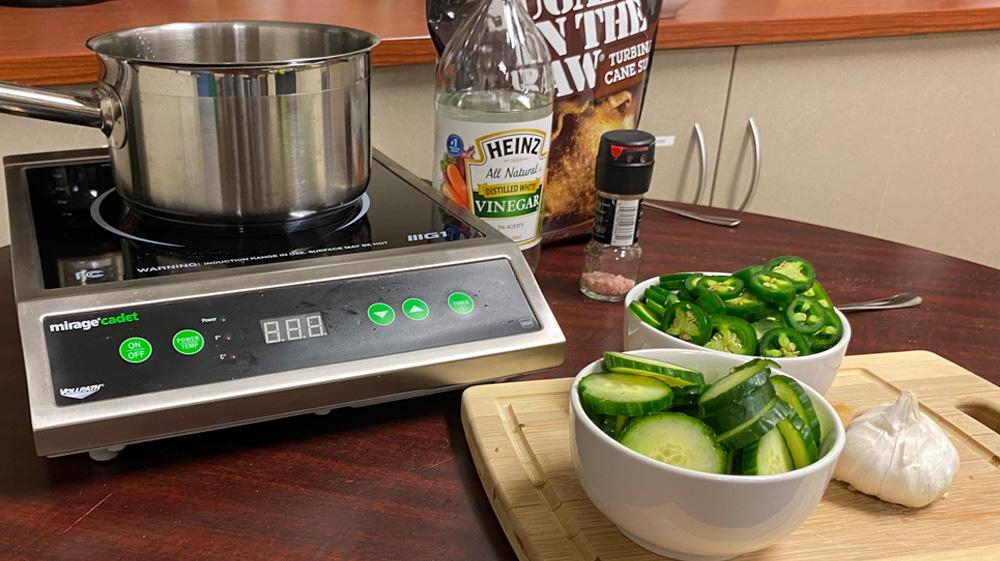 Induction cooktop with ingredients for sweet & spicy pickles