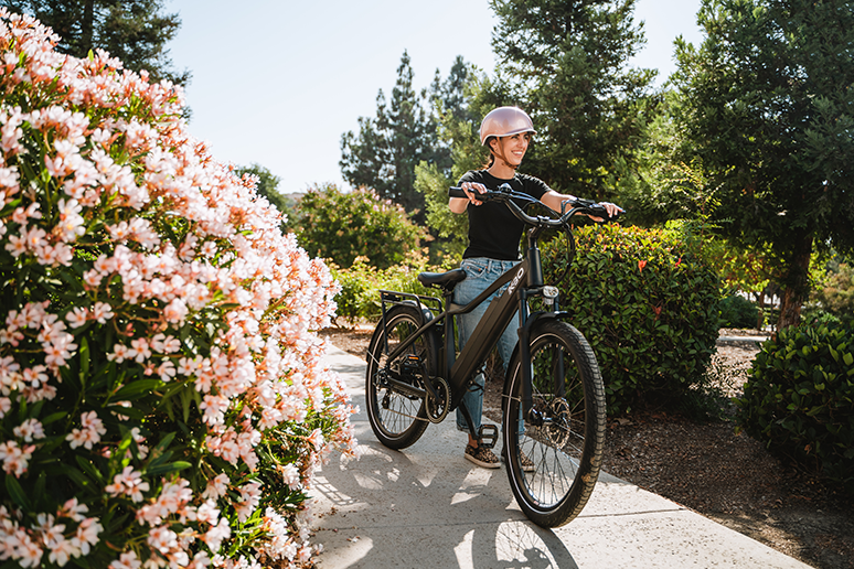 woman walks with an e-bike