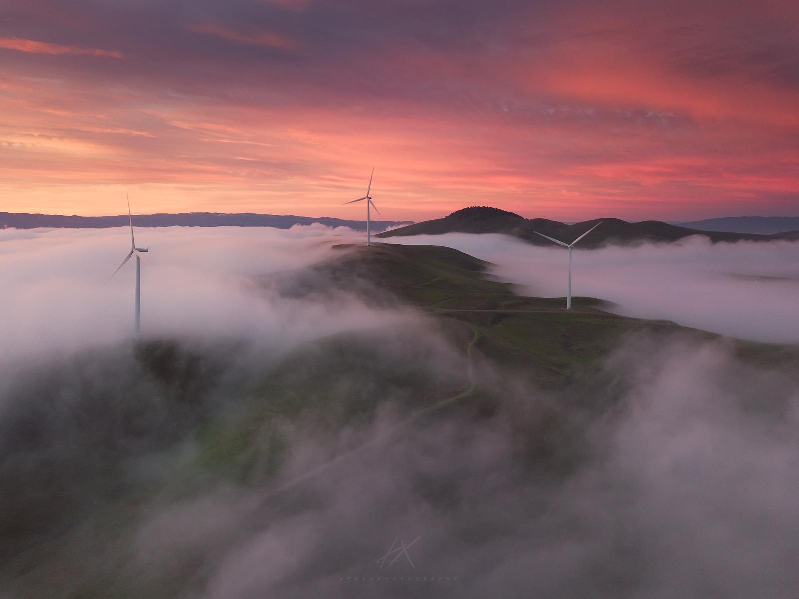 Wind turbines at Altamont Pass in the fog at sunset