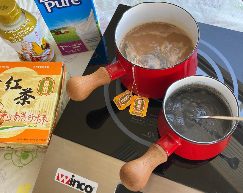 Hong Kong milk tea and black sesame soup on an induction cooktop