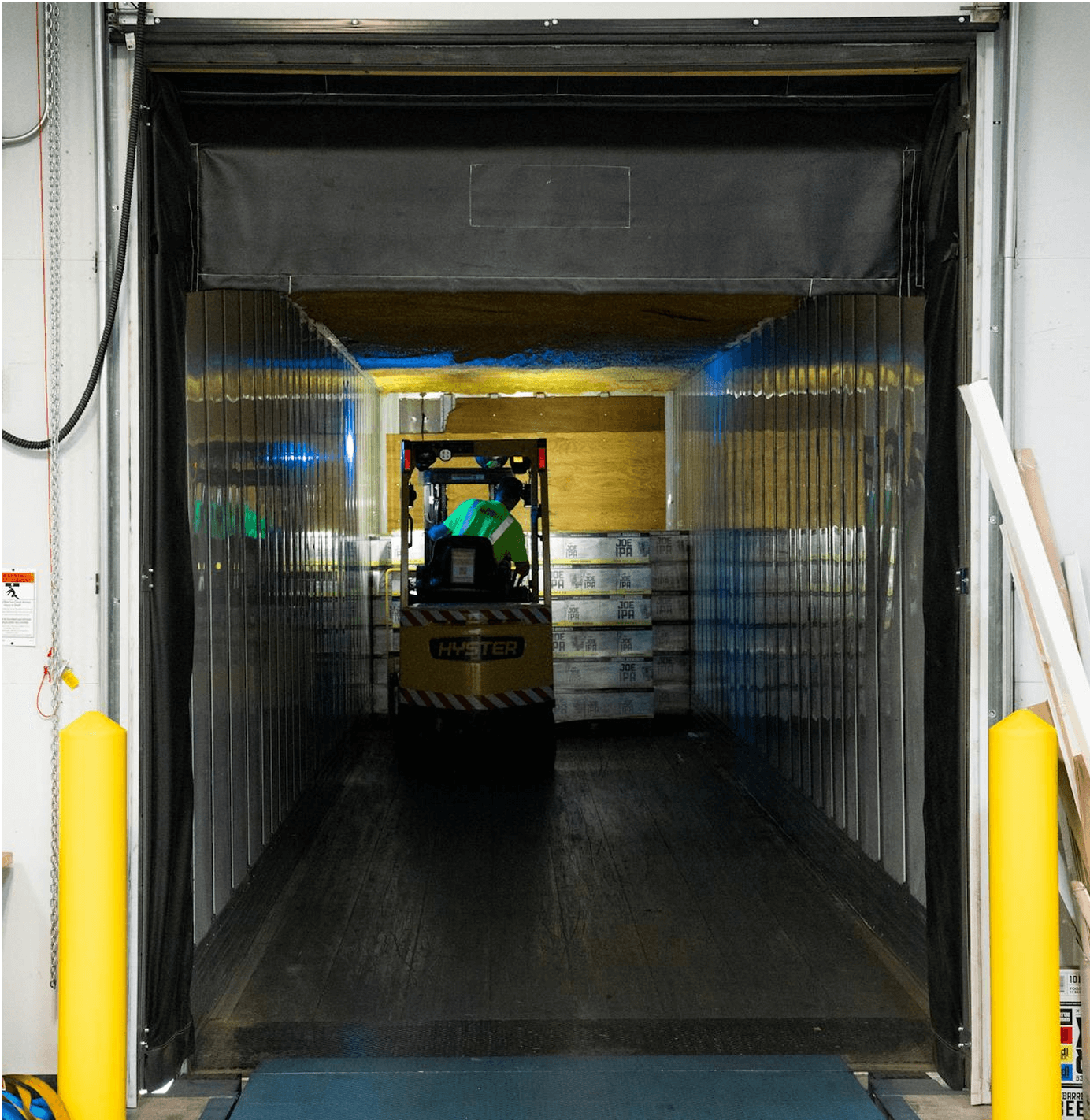 MacRay LoRaWAN ToF sensor top-mounted inside warehouse waste room for accurate fill level monitoring