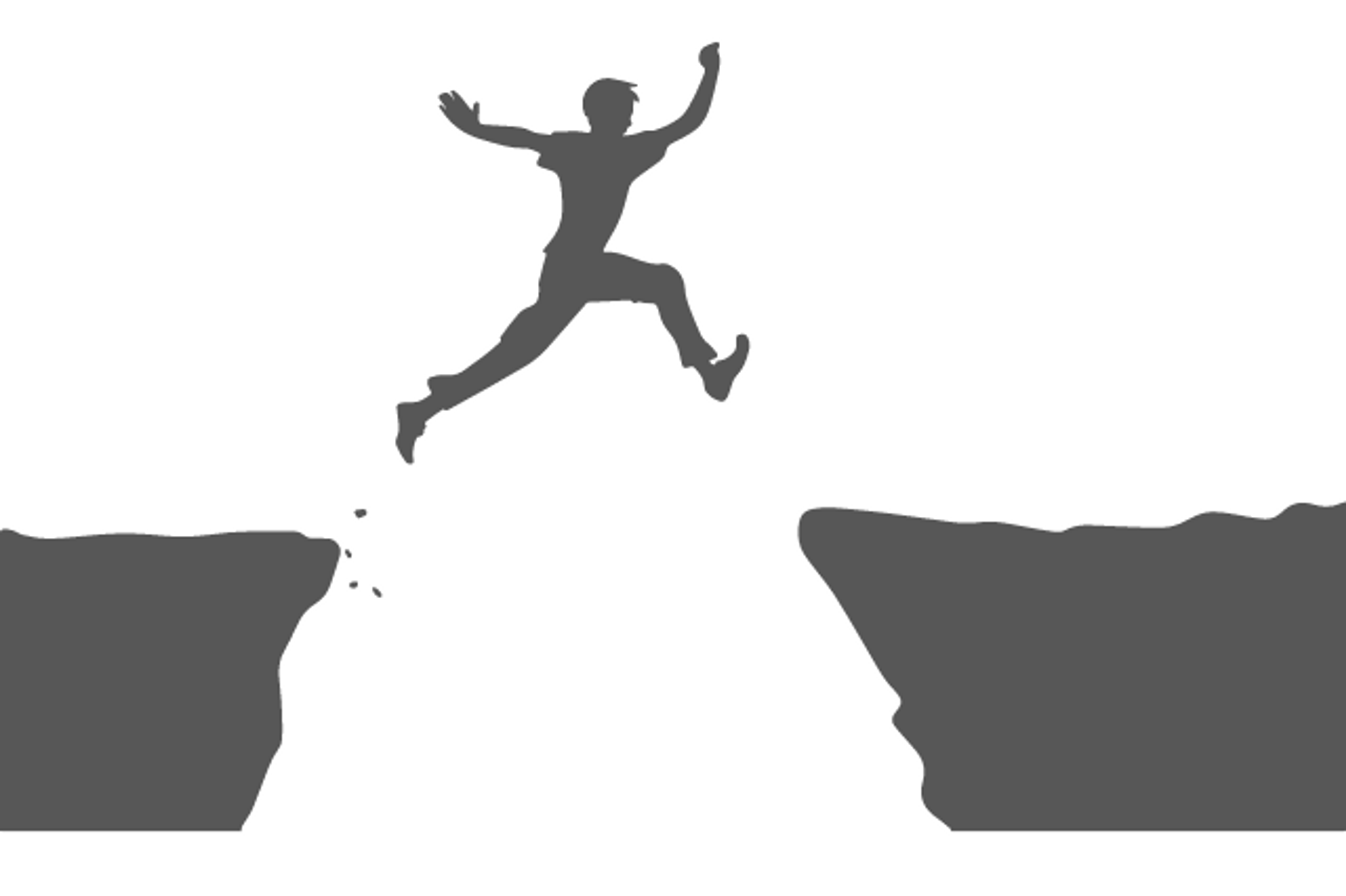 man jumping over the threshold of one cliff to another