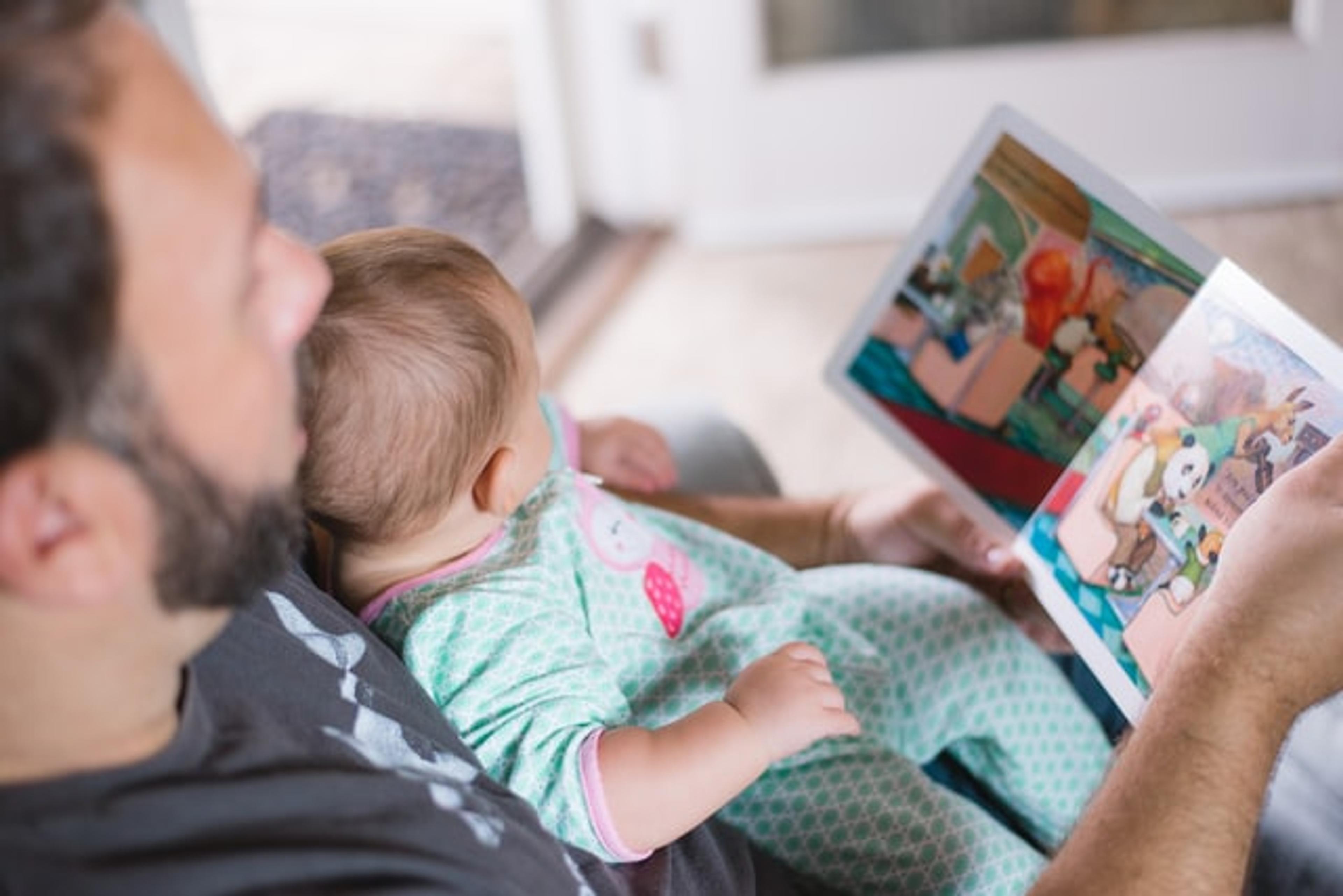 parent reading to baby