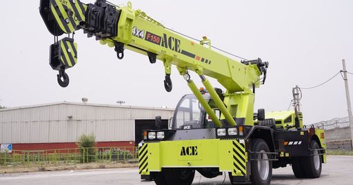 ACE F150 4x4 crane captured outside an industrial warehouse in India.