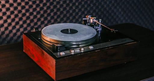 Close-up of a vintage turntable in an acoustically treated music room, capturing the nostalgic feel of retro music devices.