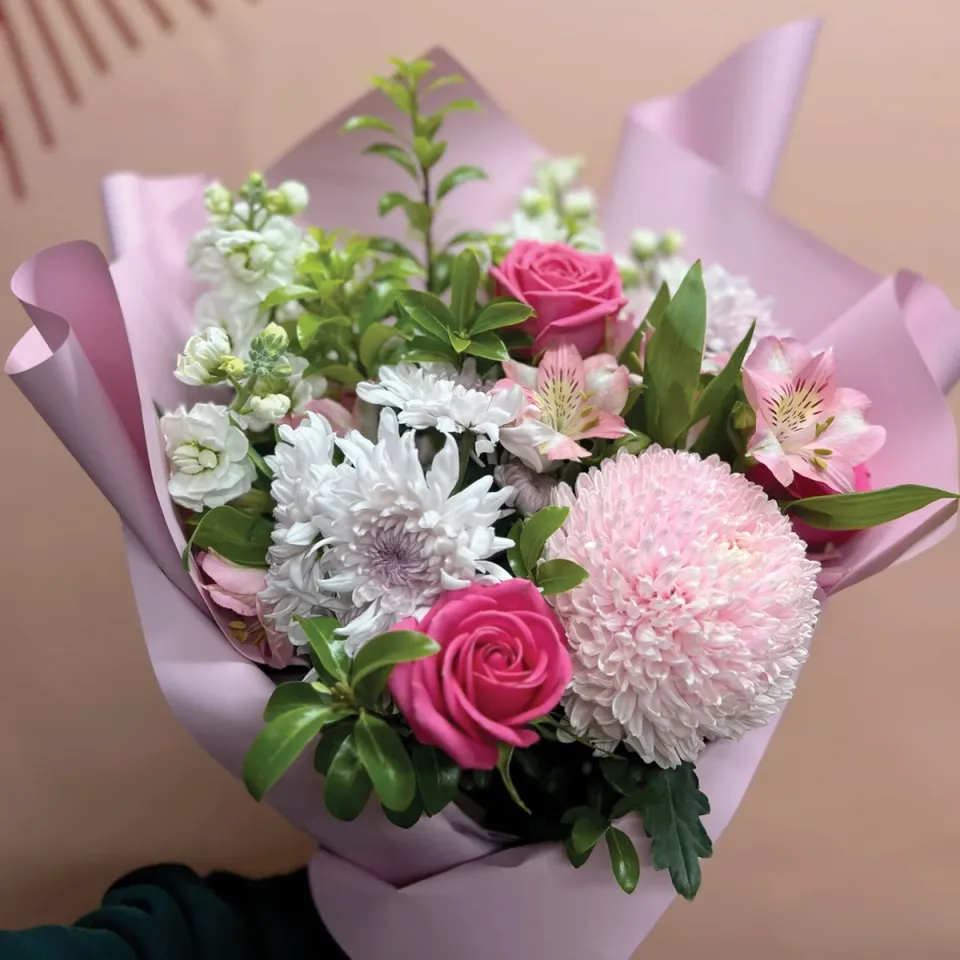 A fresh bouquet of white, pink, and purple flowers