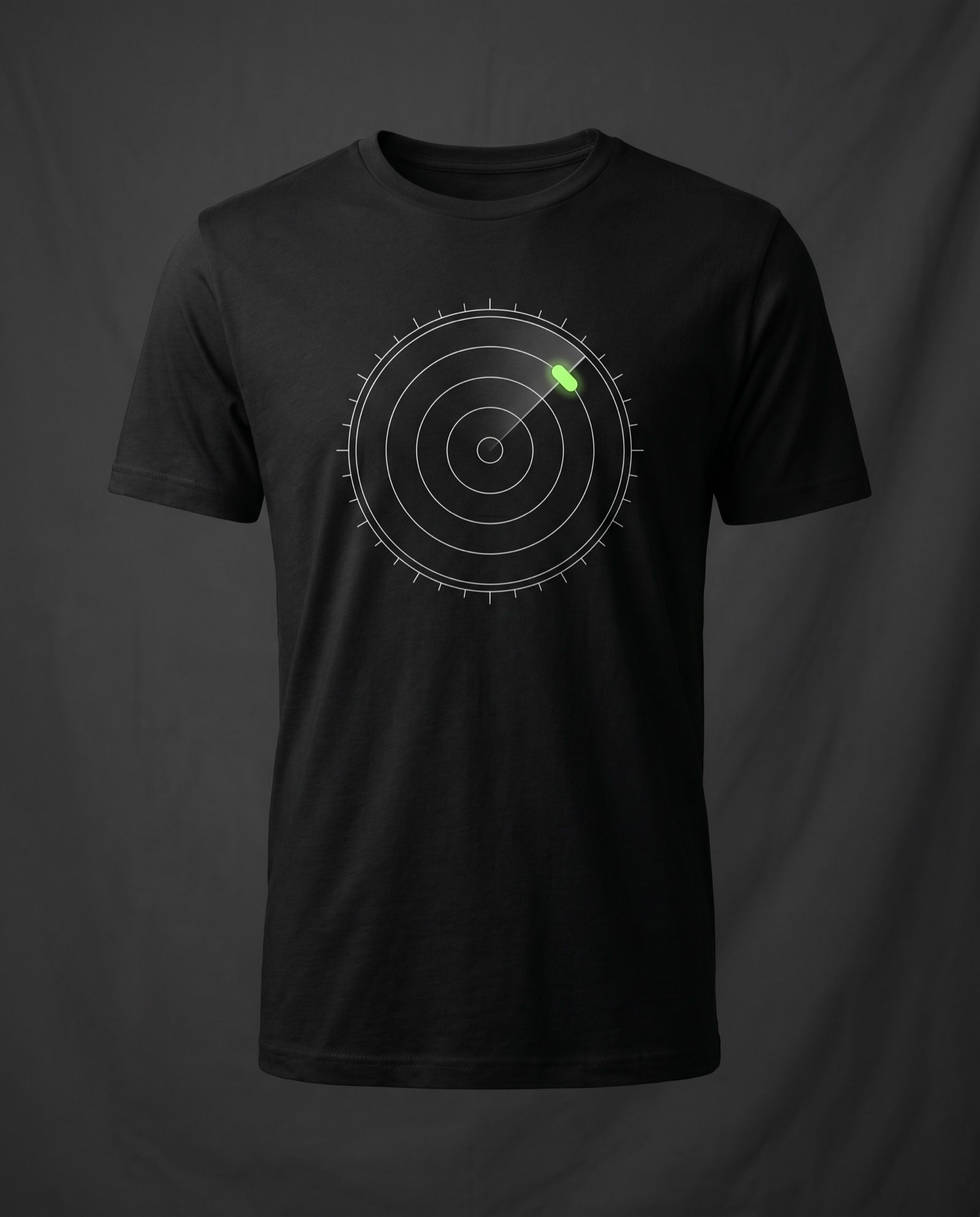 Mockup: black tee with a thin-line radar scope print and a lime blip
