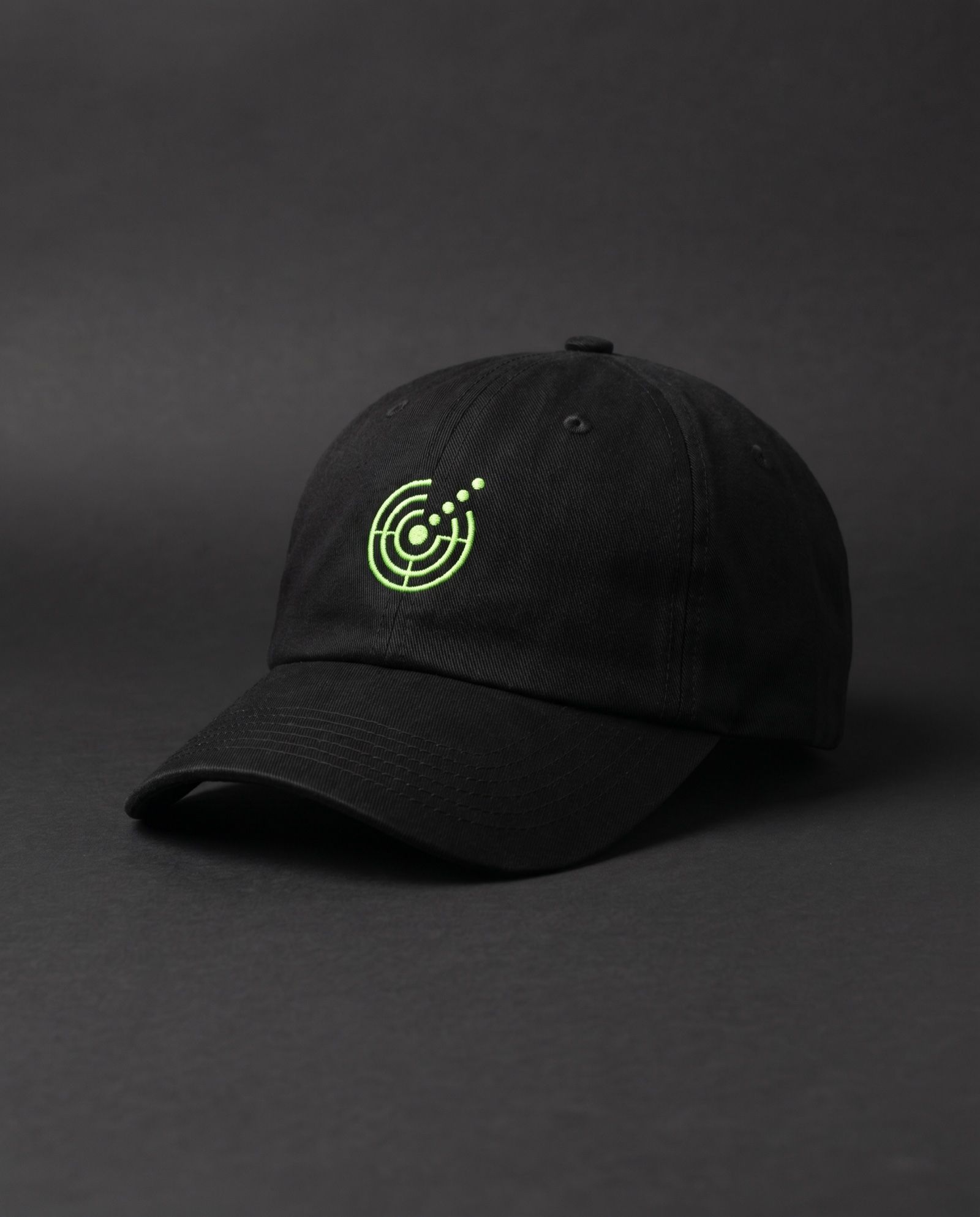 Mockup: black dad cap with the radar glyph embroidered in lime