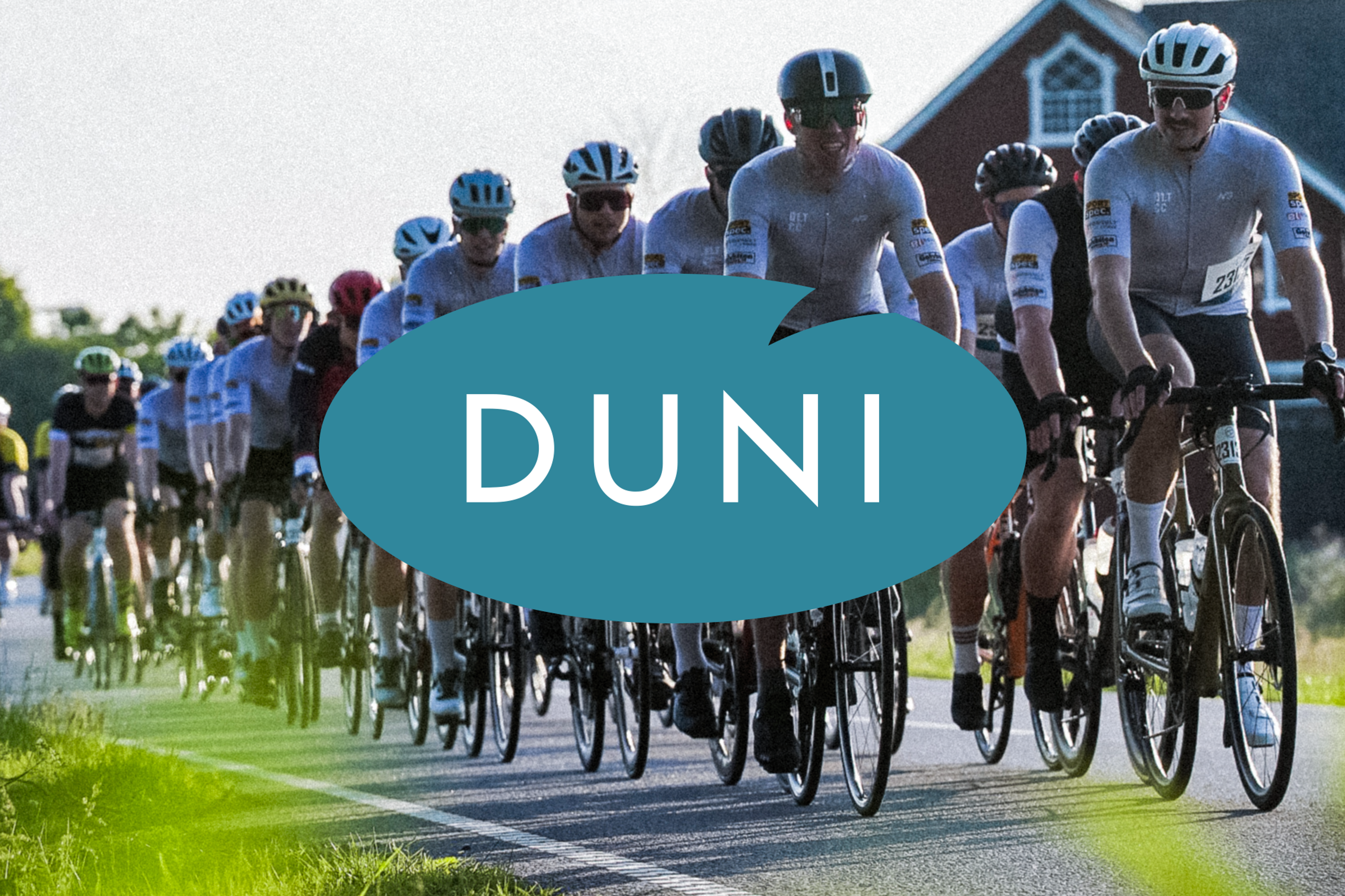 Cyclists on a road with a blue DUNI logo overlay.