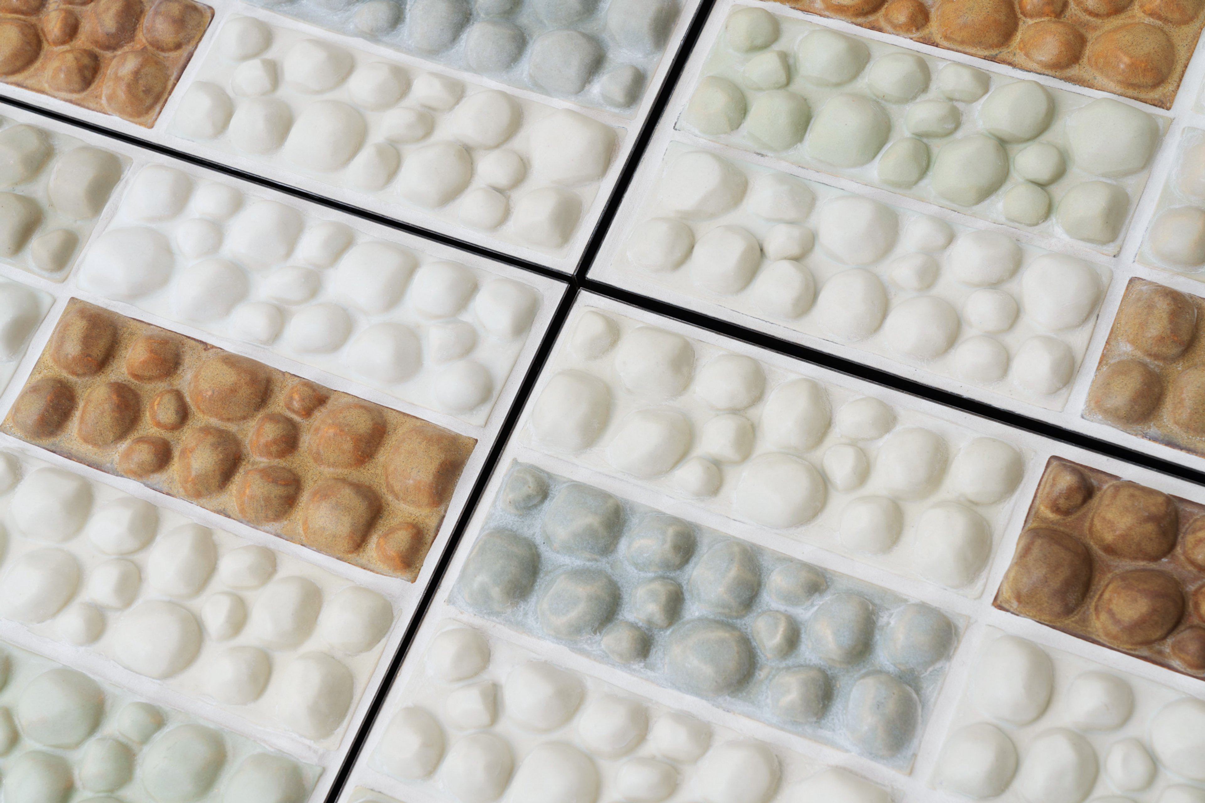 Tiles, like the walking paths, with stoney surfaces that wink at tired feet.