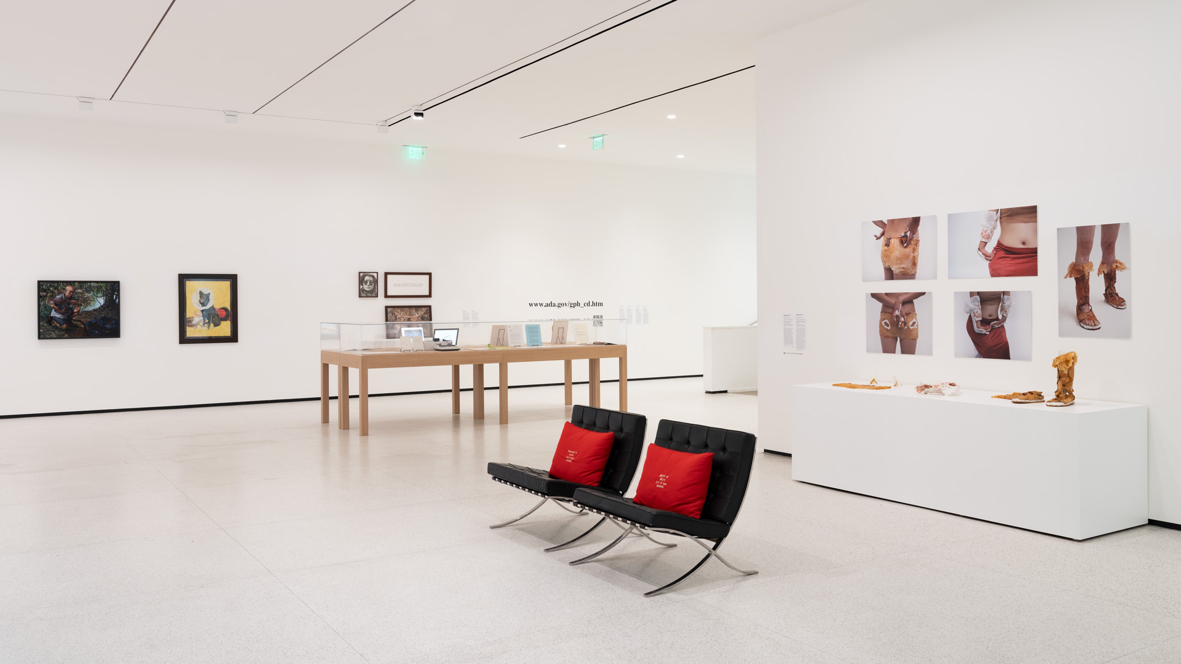 The red cushions’ embroidered proposals for rest made their way onto seating from the museum collection.